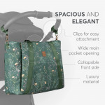 Η φωτογραφία δείχνει Μείνετε κομψοί και οργανωμένοι σε κάθε σας έξοδο με τη μαμά τσάντα FLORENCE!  Σχεδιασμένη για σύγχρονους γονείς, αυτή η πολυτελής τσάντα συνδυάζει τη λειτουργικότητα με ένα πολύχρωμο ντιζάιν στάμπα, διασφαλίζοντας ότι όλα τα απαραίτητα για το μωρό είναι οργανωμένα και προσι