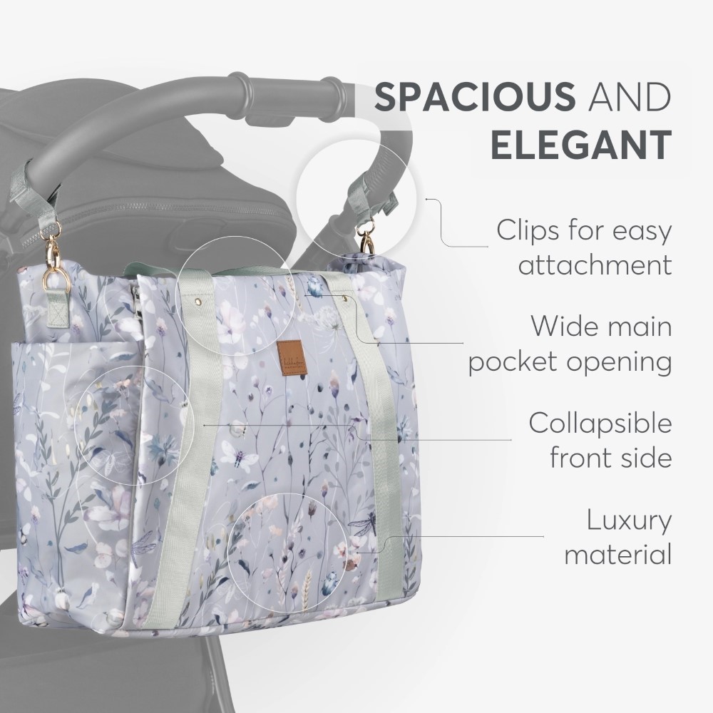 Η φωτογραφία δείχνει Μείνετε κομψοί και οργανωμένοι σε κάθε σας έξοδο με τη μαμά τσάντα FLORENCE!  Σχεδιασμένη για σύγχρονους γονείς, αυτή η πολυτελής τσάντα συνδυάζει τη λειτουργικότητα με ένα πολύχρωμο ντιζάιν στάμπα, διασφαλίζοντας ότι όλα τα απαραίτητα για το μωρό είναι οργανωμένα και προσι